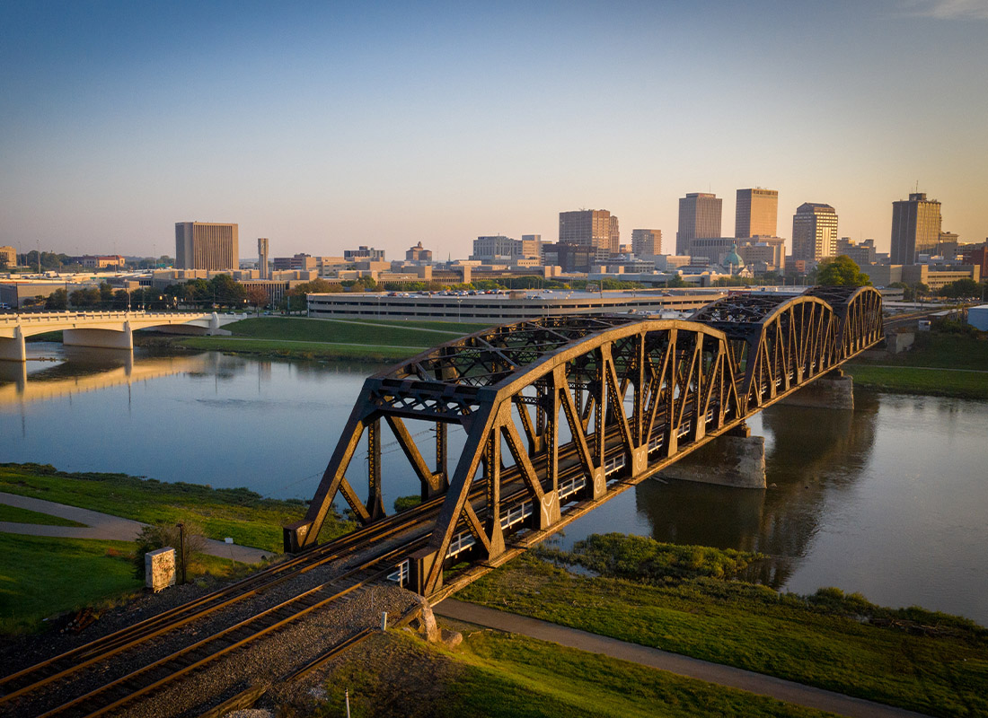 Contact - Aerial View of Dayton, Ohio River and Bridge with Cityscape in the Distance at Sunset