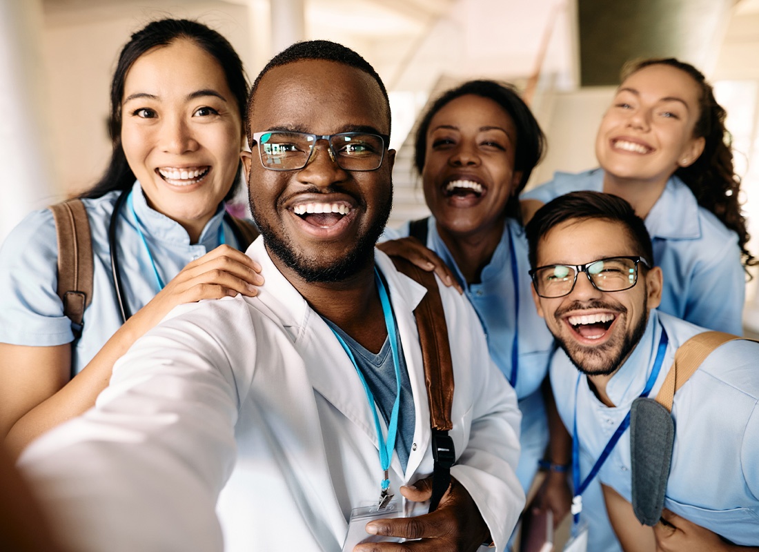 Insurance by Industry - Closeup of Happy Medical Staff Taking a Group Selfie in the Workplace